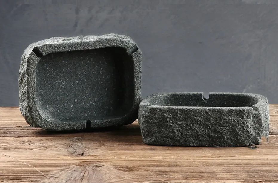 Architectural cast concrete or natural stone custom ashtray with embedded logo and unique veining for modern luxury venues