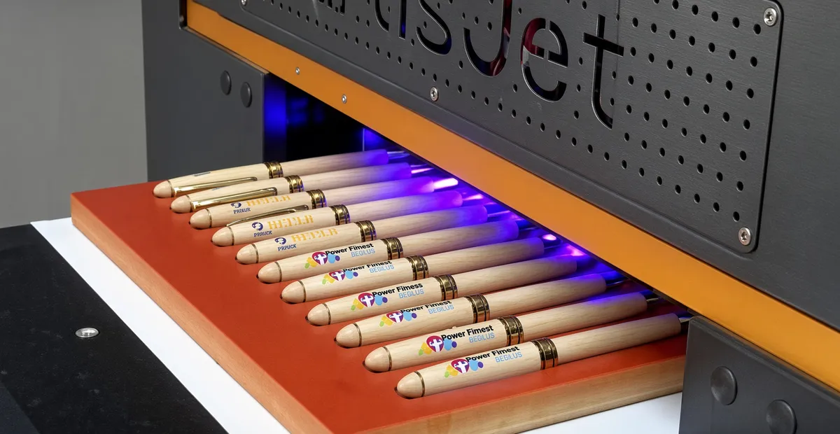 UV digital printing a full color logo on a curved plastic pen barrel