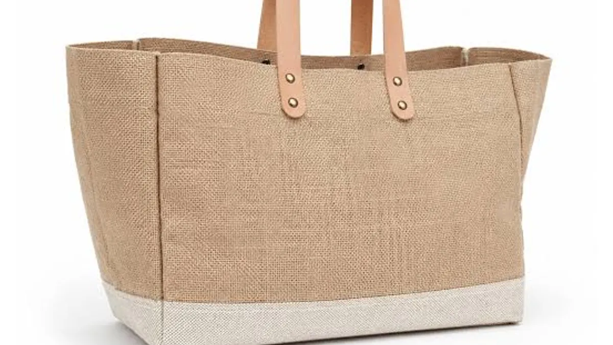 Natural jute tote bag with leather handles and a canvas base