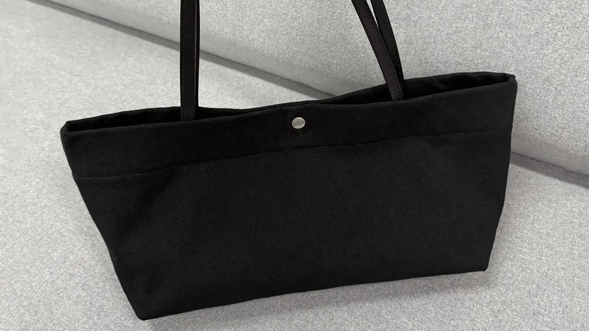 Black open top flat tote bag with long handles