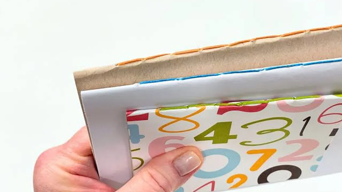 Saddle stitched booklet with staples through the folded spine
